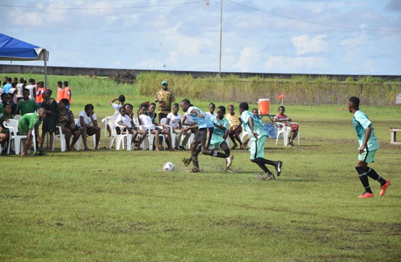 Chase Academy (Green) tracks back to defend against Vergenogen in their Quarter Final match in the ExxonMobil U-14 Schools Football tournament