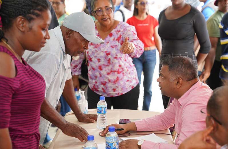 Minister within the Ministry of Public Works, Deodat Indar, listened to a range of issues raised by residents of Darthmouth (Office of the Prime Minister photo)