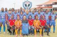 Deputy Commissioner of Administration, Ravindradat Budhram (holding team jersey) along with players and other management of the Guyana Police Force Football Club 