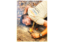 Christopher has been trained to handle a range of injuries, emergencies, and situations, as shown here starting a fire