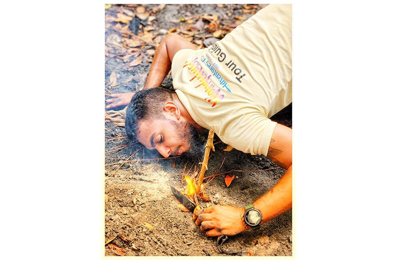 Christopher has been trained to handle a range of injuries, emergencies, and situations, as shown here starting a fire