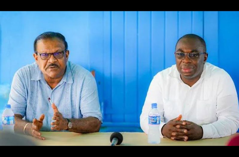 Minister within the Office of the Prime Minister, Kwame McCoy and Minister within the Ministry of Local Government and Regional Development, Anand Persaud engage residents at Affiance
