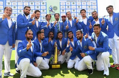 The first one - the Afghanistan players celebrate their maiden Test win (AFP)