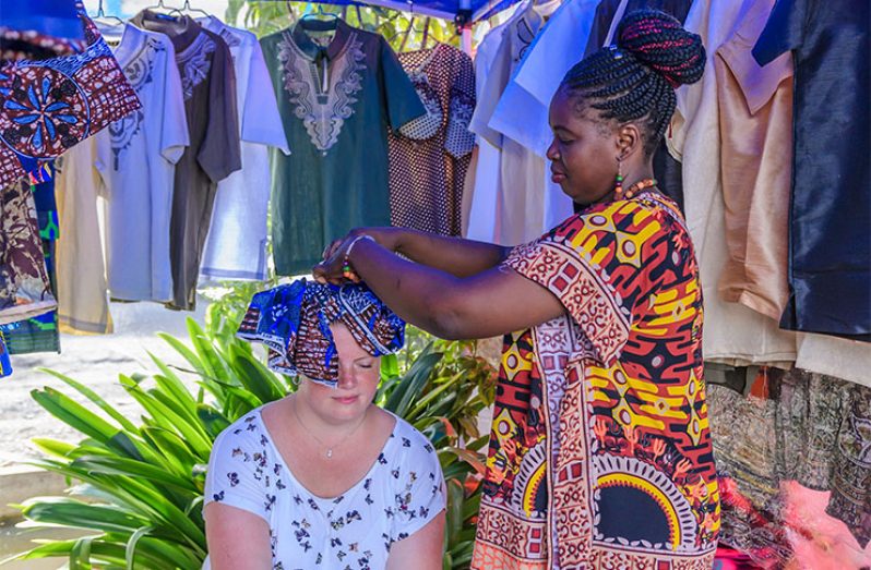 A customer getting her head wrapped