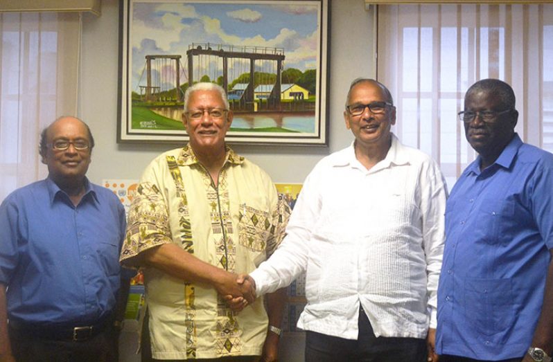 From left: NAREI’s CEO, Dr. Oudho Homenauth; Agriculture Minister, Noel Holder; CATIE Director General, Muhammad Ibrahim; and GLDA CEO, Nigel Cumberbatch