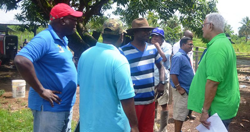 Agri.-Minister-Noel-Holder,-GLDA-CEO-Mr.-Nigel-Cumberbatch-while-engaging-farmers-during-the-outreach-web