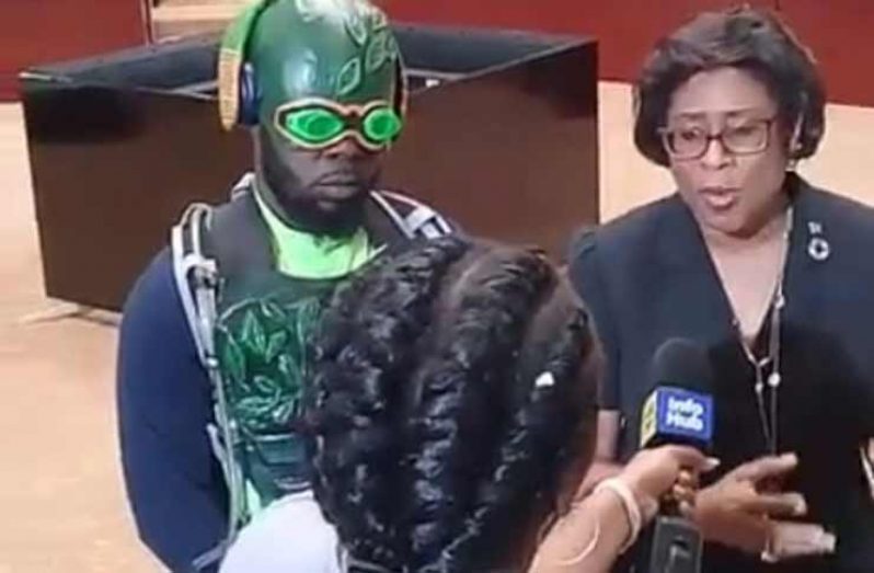 Minister of Public Telecommunications, Catherine Hughes and Trinidad Super-hero ”Agri-man”, Guyanese-born George Caesar, during an interview at the Arthur Chung Conference Centre during the roadshow.