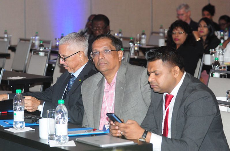 From right: Finance Controller/Company Secretary of Sterling Products Limited, Deodat Indar; Vice Chairman of the Guyana Manufacturing and Services Association, Ramsay Ali and Minister of Business, Dominic Gaskin at the Business summit on Wednesday