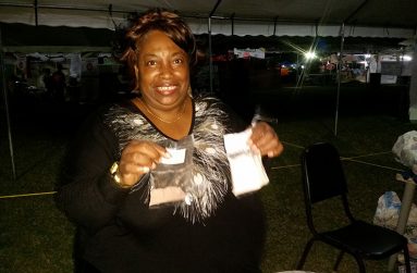 Celine Webster holding her freshly made seasonings in her hand