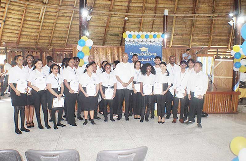 Minister of Public Works, Bishop Juan Edghill (center) Civil Aviation Training School graduands