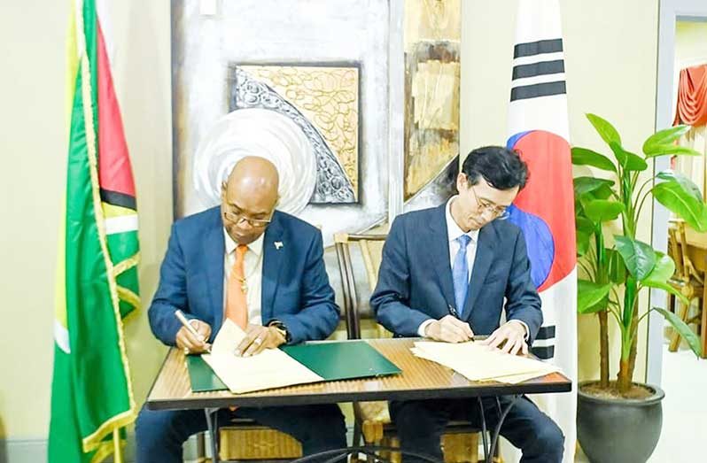 Minister of Public Works, Juan Edghill and Ambassador KIM Jinhae, Non-Permanent Representative of the Republic of Korea to the Caribbean Community Secretariat sign the air services agreement