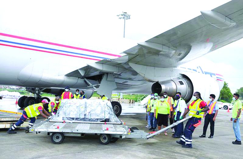 The first batch of the Oxford-AstraZeneca vaccine for COVID-19, made available through the COVAX facility, being offloaded from the AmeriJet International aircraft which arrived, Monday, at 09:40 hours at the Cheddi Jagan International Airport (CJIA)