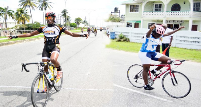 In this Samuel Maughn composite photo Akeem Arthur (left) of District 10 and Whitney Poyer of District 6 cross the finish line unchallenged to win the boys’ and girls’ categories of the GTU National Cycling championships yesterday.