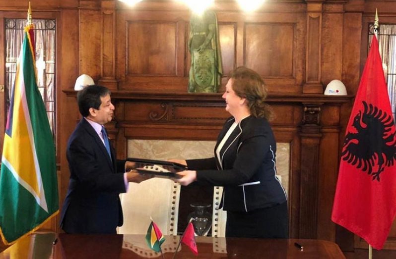 Ambassador of Guyana to the United States, Dr. Riyad Insanally, and Ambassador of Albania to the United States, Floreta Faber, sign the MoU on behalf of their respective governments