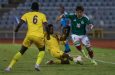 Mexico’s Alberto Cisneros (right) dribbles his way past two Barbados defenders (Photo courtesy CONCACAF)