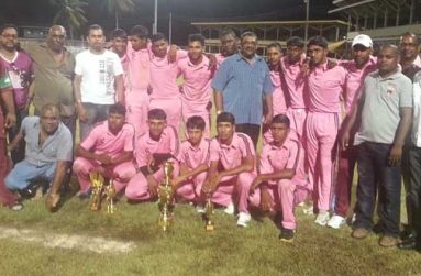 The victorious Albion Community Centre Cricket Club smartly display their new uniforms, the kind compliments of middle-order batsman Narsingh Deonarine and the CARICOM Day ‘Albion Cup’, with Minister of Agriculture Leslie Ramsammy (at right).