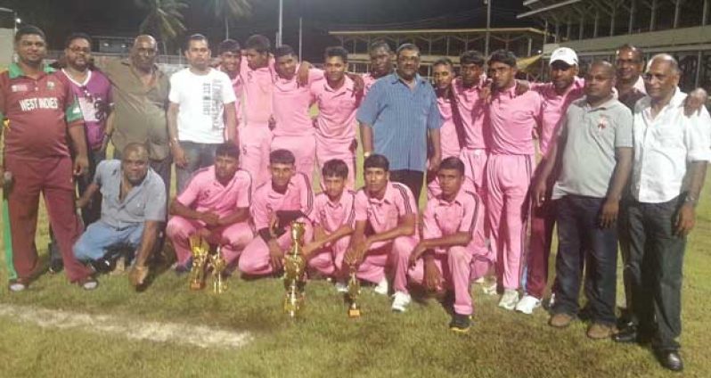 The victorious Albion Community Centre Cricket Club smartly display their new uniforms, the kind compliments of middle-order batsman Narsingh Deonarine and the CARICOM Day ‘Albion Cup’, with Minister of Agriculture Leslie Ramsammy (at right).