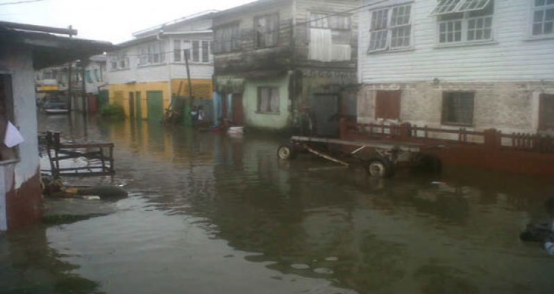 The state of one of the streets in flood-hit Albouystown yesterday (Photo courtesy of Demerara Waves)