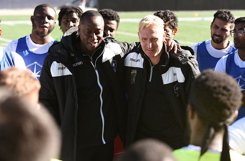 Guyana's Alex Bunbury and Valour FC head coach Robert Gale during one of the club's tryouts.