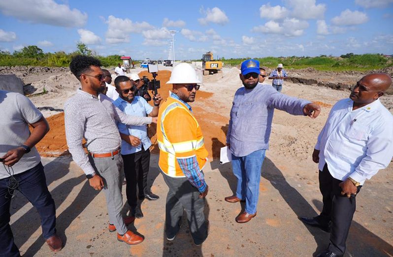 President, Dr. Irfaan Ali interacting with contractors (Office of the President photo)