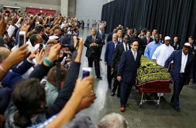 Worshippers and well-wishers take photographs as the casket with the body of the late boxing champion Muhammad Ali is brought for his jenazah, an Islamic funeral prayer, in Louisville, Kentucky, U.S. yesterday. (Reuters/Carlos Barria)
