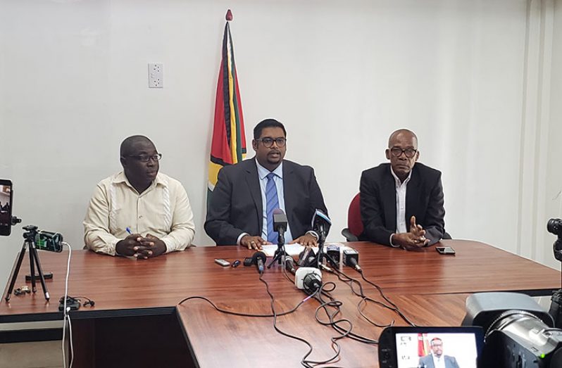 PPP/C presidential candidate, Irfaan Ali, flanked by parliamentarian Joseph Hamilton and communication officer Kwame McCoy at the press briefing on Thursday