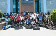 President Dr Mohamed Irfaan Ali, government ministers, members from the Guyana Cricket Board and youths at the distribution exercise on Saturday