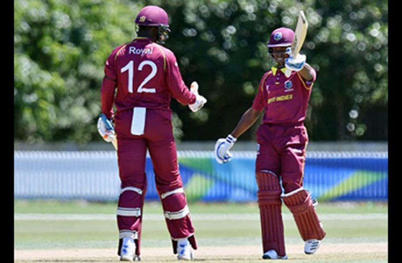 Man-of-the Match Alick Athanaze (right) celebrates his unbeaten 116 against Kenya Under-19s yesterday.