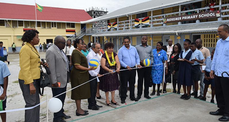 Minister of Social Cohesion Amna Ally about to cut the ribbon to official declared the Volleyball Court open. (Cullen Bess-Nelson photo)