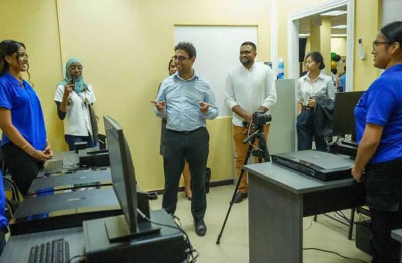 Minister Ally interacting with staff at the Bartica Service Centre in Region Seven