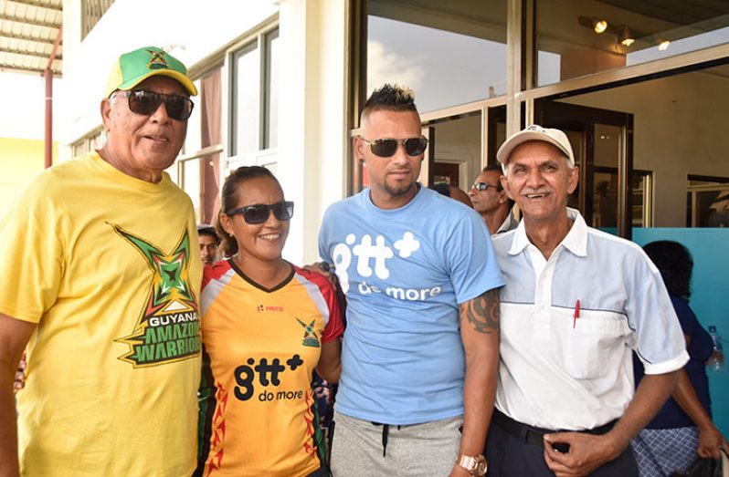 Amazon Warriors Captain Rayad Emritt poses with a few fans by the Imran Bacchus supermarket in Essequibo (Adrian Narine Photo)