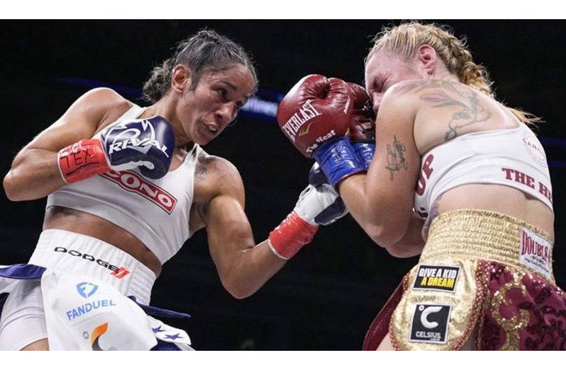 Amanda Serrano (left) retained her undisputed featherweight titles with victory against Heather Hardy.