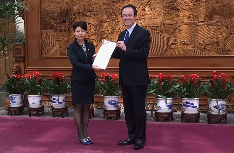 Ambassador Anyin Choo presenting her Letter of Credence to Hong Lei, Director-General of the Department of Protocol and Consular Affairs of the Ministry of Foreign Affairs of the People's Republic of China, in Beijing on Friday