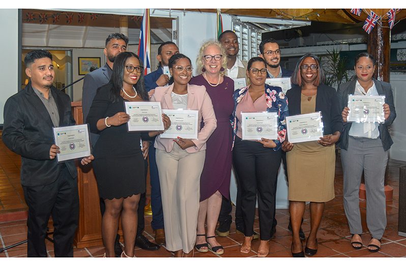 British High Commissioner to Guyana, Jane Miller (centre), flanked by this year’s cohort of Get Safe Online ambassadors (Japheth Savory photo)