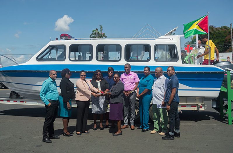 Minister of Public Health Volda Lawrence handing over the key to the ambulance to Region 10 Regional Health Officer (RHO), Dr. Pansy Armstrong in the presence of other health and regional officials 
(Photos by Delano Williams)
