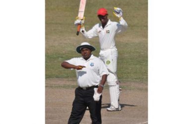 As umpire Delvin Austin signals his 10th four, Demerara batsman Amir Khan celebrates his maiden Inter-county century, after recording same as a nightwatchman against GCB Developmental XI yesterday.