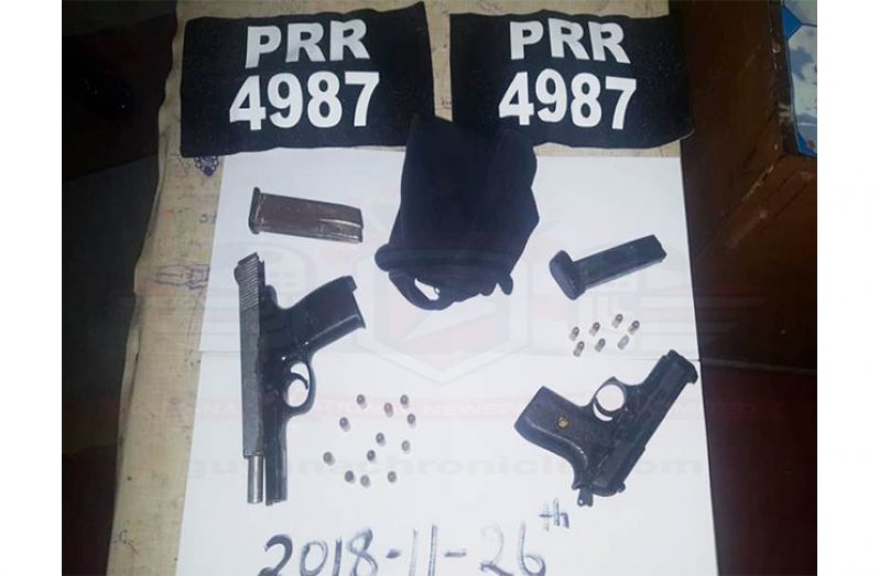 The guns and ammunition as well as "paste on" car tags which the men had in their possession.