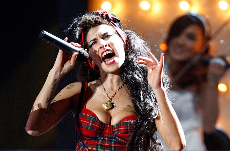 British singer Amy Winehouse performs at the Brit Awards at Earls Court in London February 20, 2008. REUTERS/Alessia Pierdomenico/File Photo
