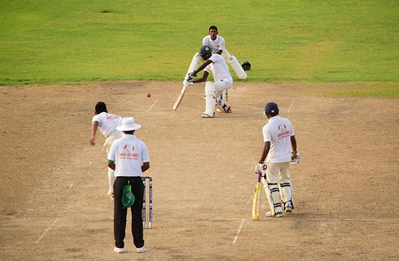 Berbice batsman Kevlon Anderson is a picture of concentration as he drives into the off-side during his unbeaten knock of 73 on day two against the Select U-17 team. (Adrian Narine photo)