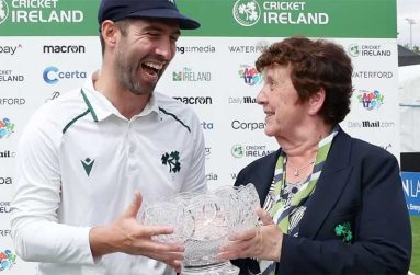 Joy for Andrew Balbirnie as he receives the trophy after Ireland's victory.