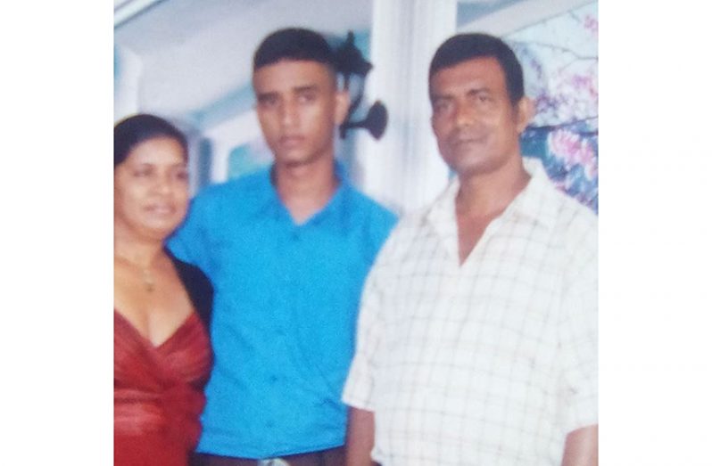 Andy Gajadhar (centre) with parents Dolly and Andrew in happier times