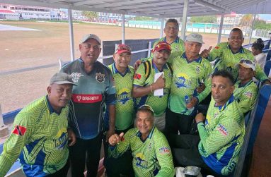 Anil Beharry with members of Valley Boys cricket team.