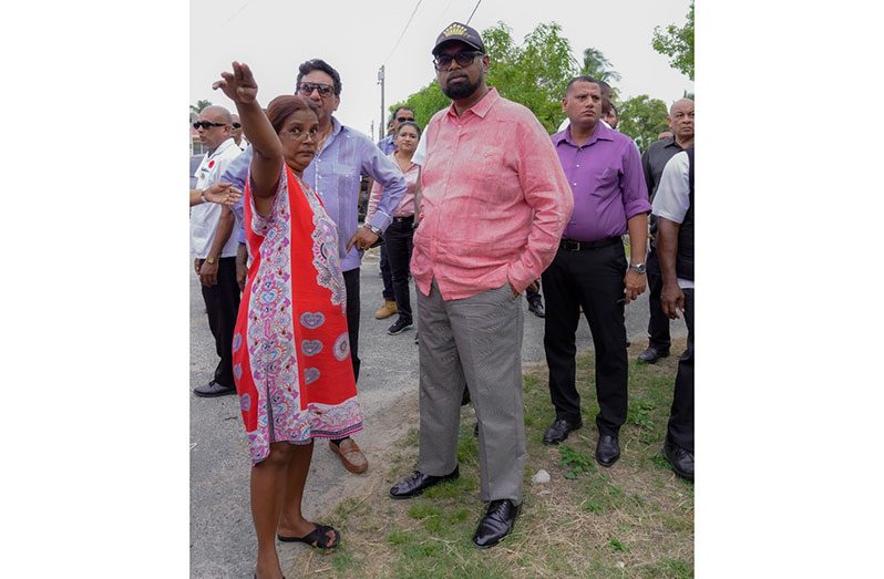 President Dr. Irfaan Ali and team listening to the concerns of a resident of Annandale, East Coast Demerara, on Thursday