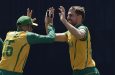 South Africa’s Anrich Nortje, right, celebrates with teammate Keshav Maharaj after the dismissal of Sri Lanka’s Charith Asalanka