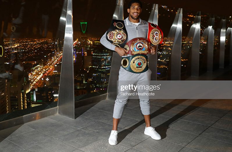 Two time Heavyweight Champion of the World, Anthony Joshua poses for pictures overlooking Riyadh after the IBF, WBA, WBO & IBO World Heavyweight Title Fight between Andy Ruiz Jr and Anthony Joshua at the the Al Faisaliah Hotel on December 08, 2019 in Riyadh, Saudi Arabia. (Photo by Richard Heathcote/Getty Images)
