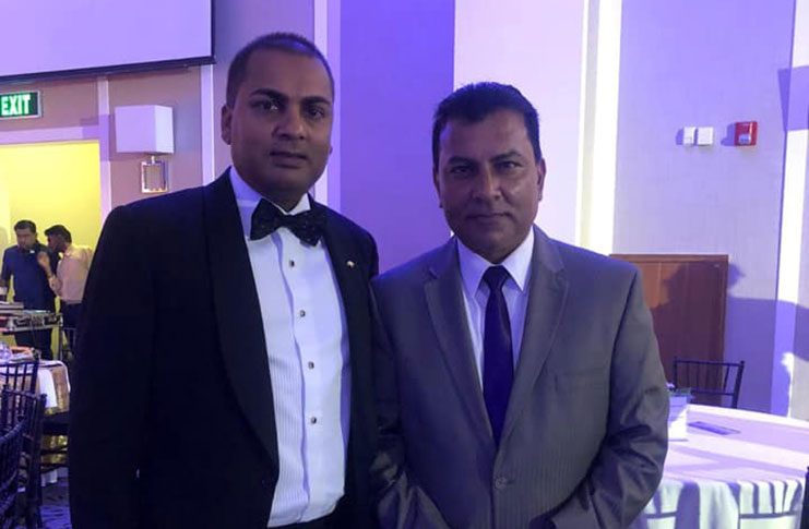Anter Narine in the company of PPP surrogate Peter Ramsaroop.