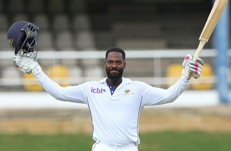 Opener Anthony Alleyne celebrates reaching his maiden first class century against T&T Red Force at Queen’s Park Oval on Sunday. (Photo courtesy WICB Media)