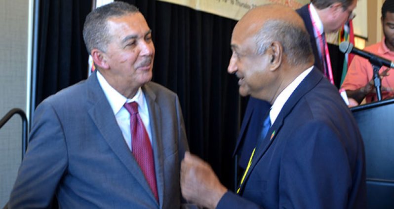 President Anthony Carmona of Trinidad and Tobago greets acting Chancellor of the Judiciary, Carl Singh, following the former’s presentation at the conference on Tuesday morning