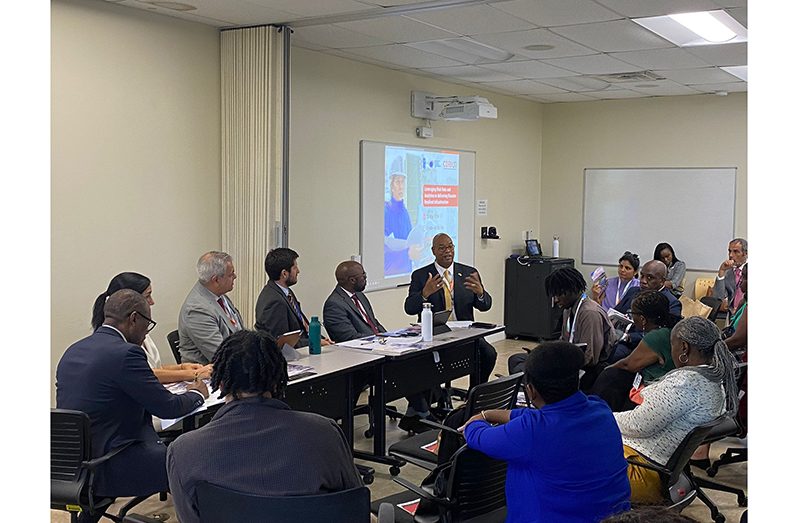 Minister of Public Works, Bishop Juan Edghill (at the head table) grabs everyone’s attention during his presentation at the conference in Antigua