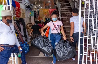 A customer leaving Ariel’s with her purchases (Delano Williams Photos)